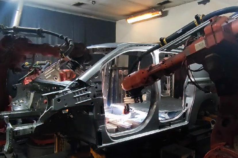 Machine vision inspects welds to car body