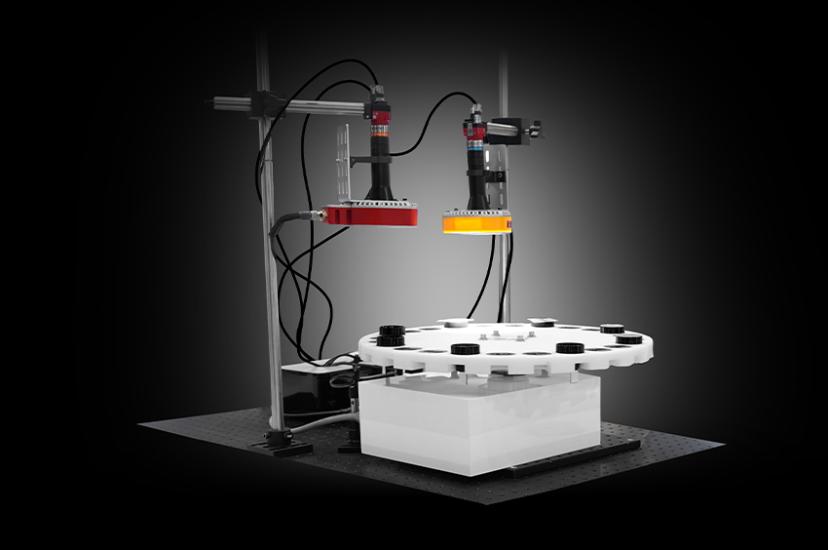 Optical measurement and testing setup with two machine vision cameras and a rotating sample stage