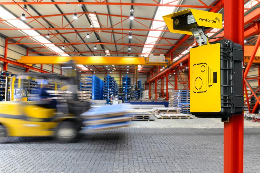Forklift travelling quickly in logistics centre