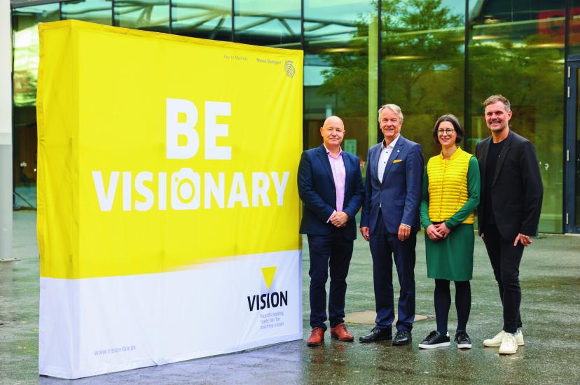 Mark Williamson, Chairman of the VDMA Machine Vision Board, Roland Bleinroth, CEO of Messe Stuttgart, Anne Wendel, Director of the VDMA Machine Vision group and Florian Niethammer, Project Manager of VISION 2026 at Messe Stuttgart, in front of VISION 2024 trade fair at Messe Stuttgart