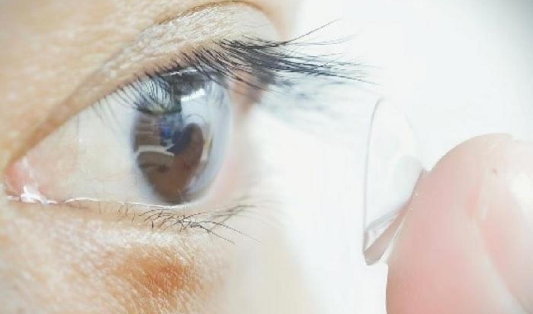 Study participant putting contacts in