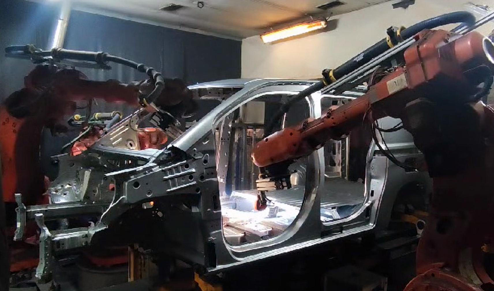 Machine vision inspects welds to car body