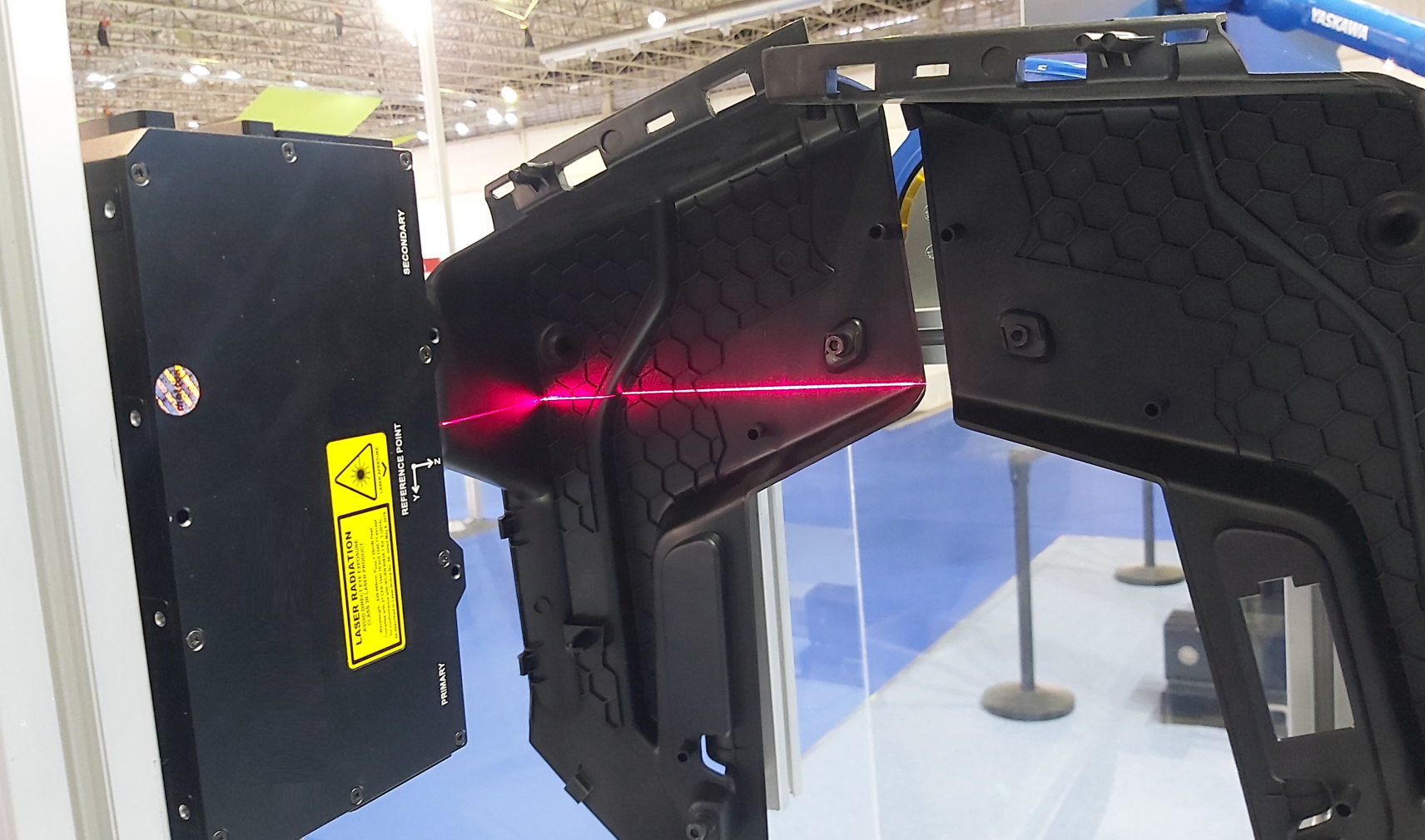 Injection-moulded plastic part being scanned for defects