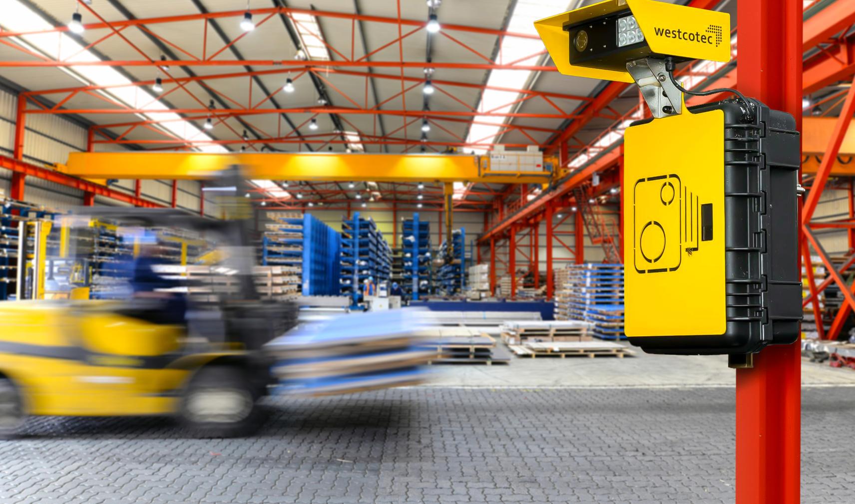 Forklift travelling quickly in logistics centre