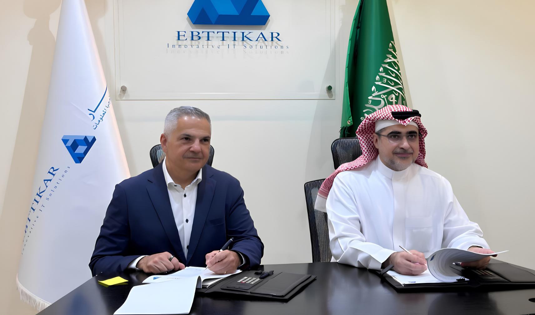 Ross Jatou and Rashid AlBallaa sign an agreement