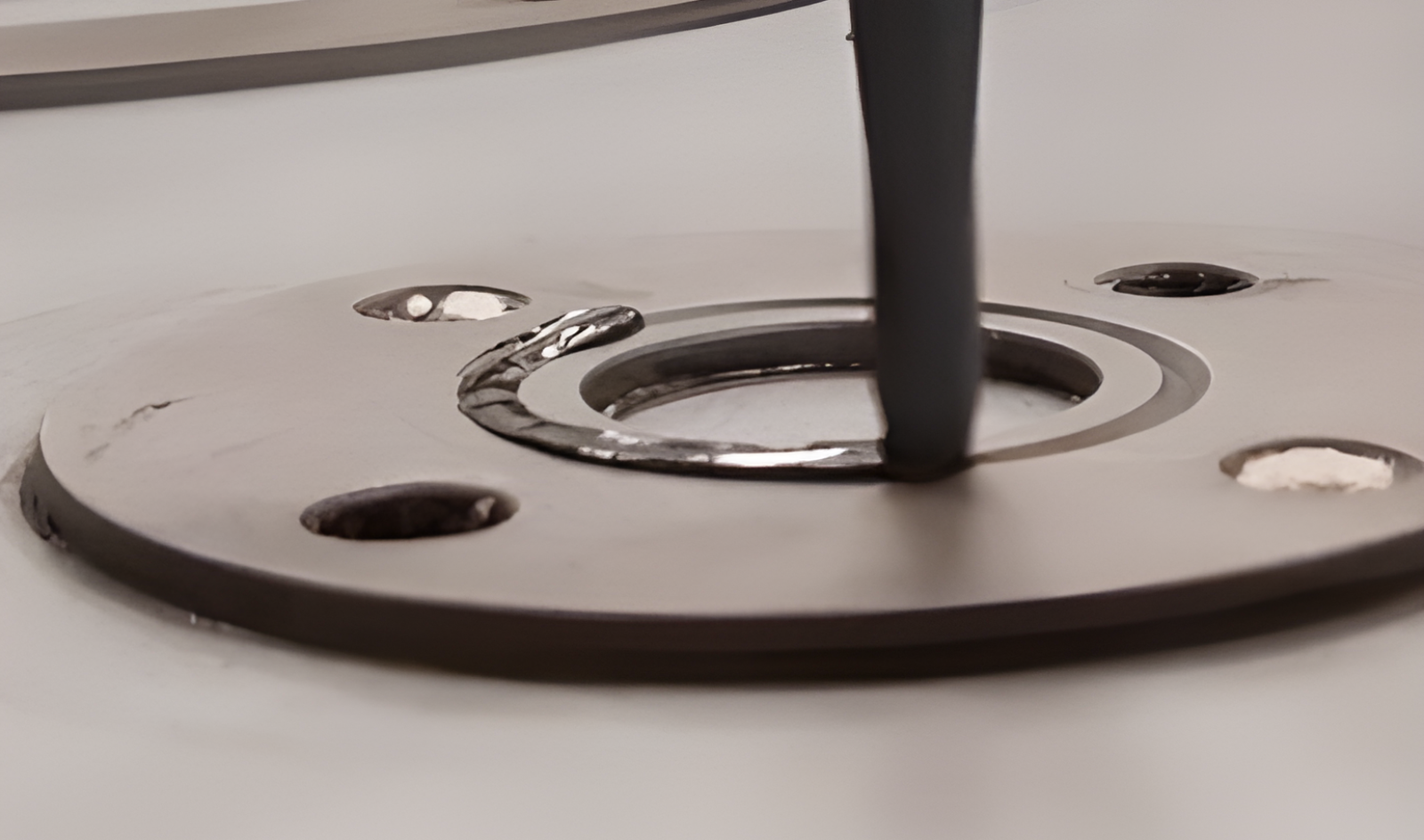 the application of sealant to painted metal bearings