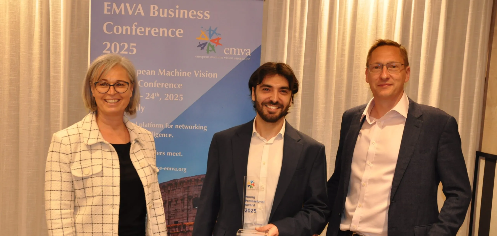 EMVA Board Member Petra Thanner and EMVA President Dr Chris Yates, right, present the EMVA Young Professional Award 2025 to Dr Rolandos Alexandros Potamias at teh 2025 EMVA Business Conference in Rome (Image: EMVA)