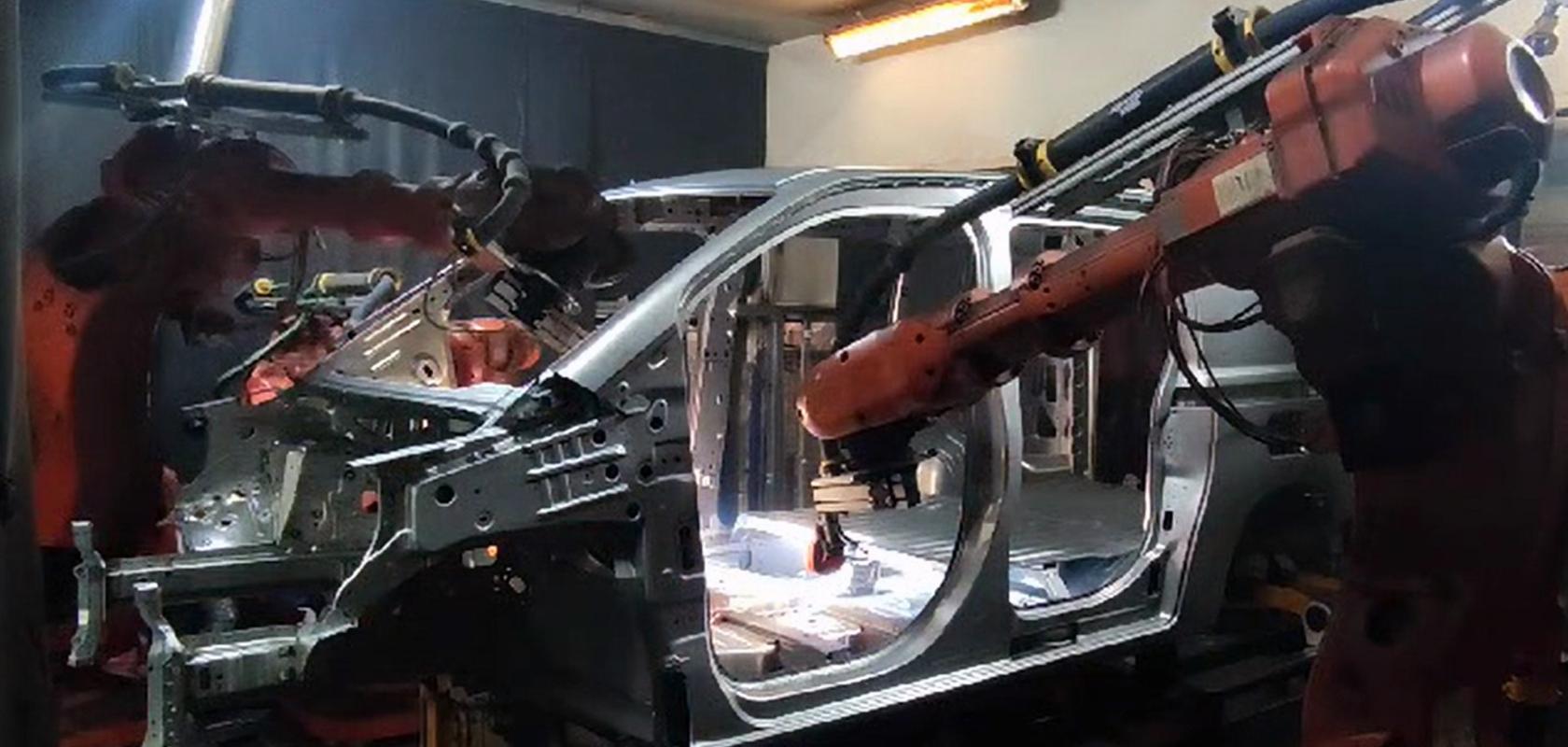 Machine vision inspects welds to car body