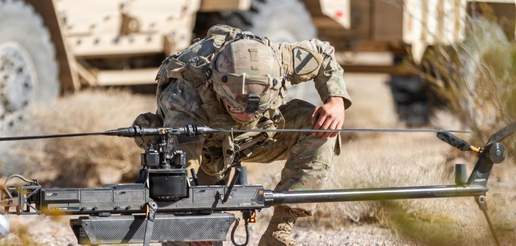 US Army unmanned aircraft system operator prepares an Anduril Ghost X for flight