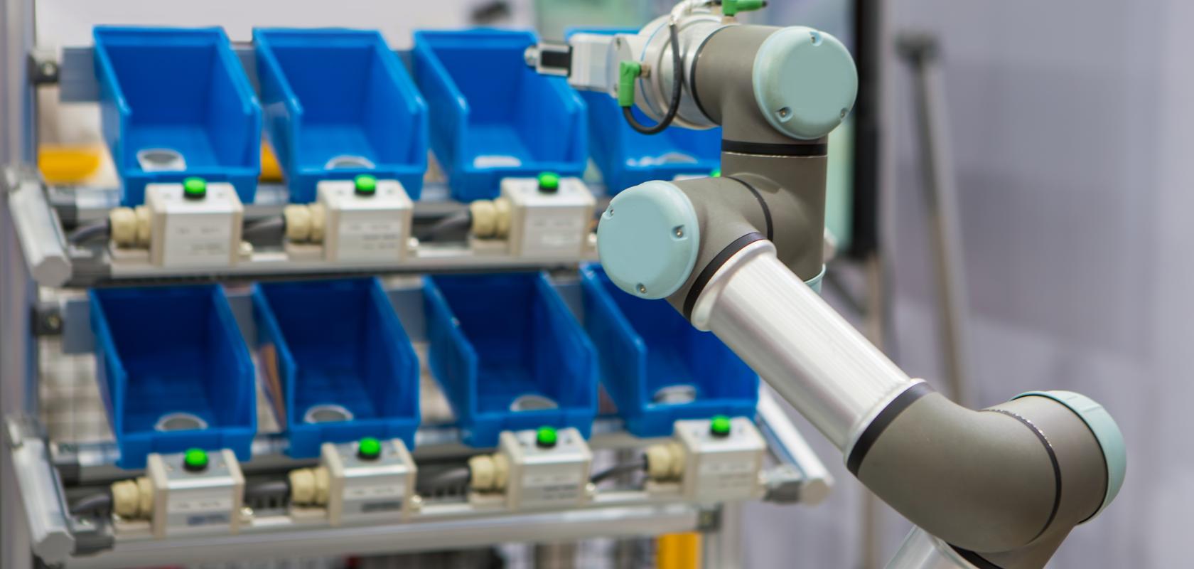 Smart warehouse: Robots pick up parts from plastic bin rack (Credit: Itsanan / Shutterstock.com)