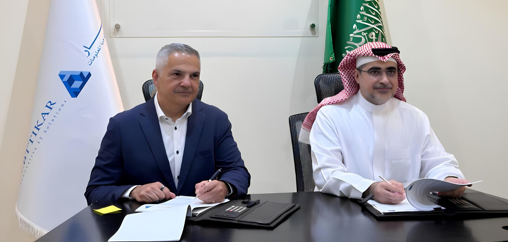 Ross Jatou and Rashid AlBallaa sign an agreement