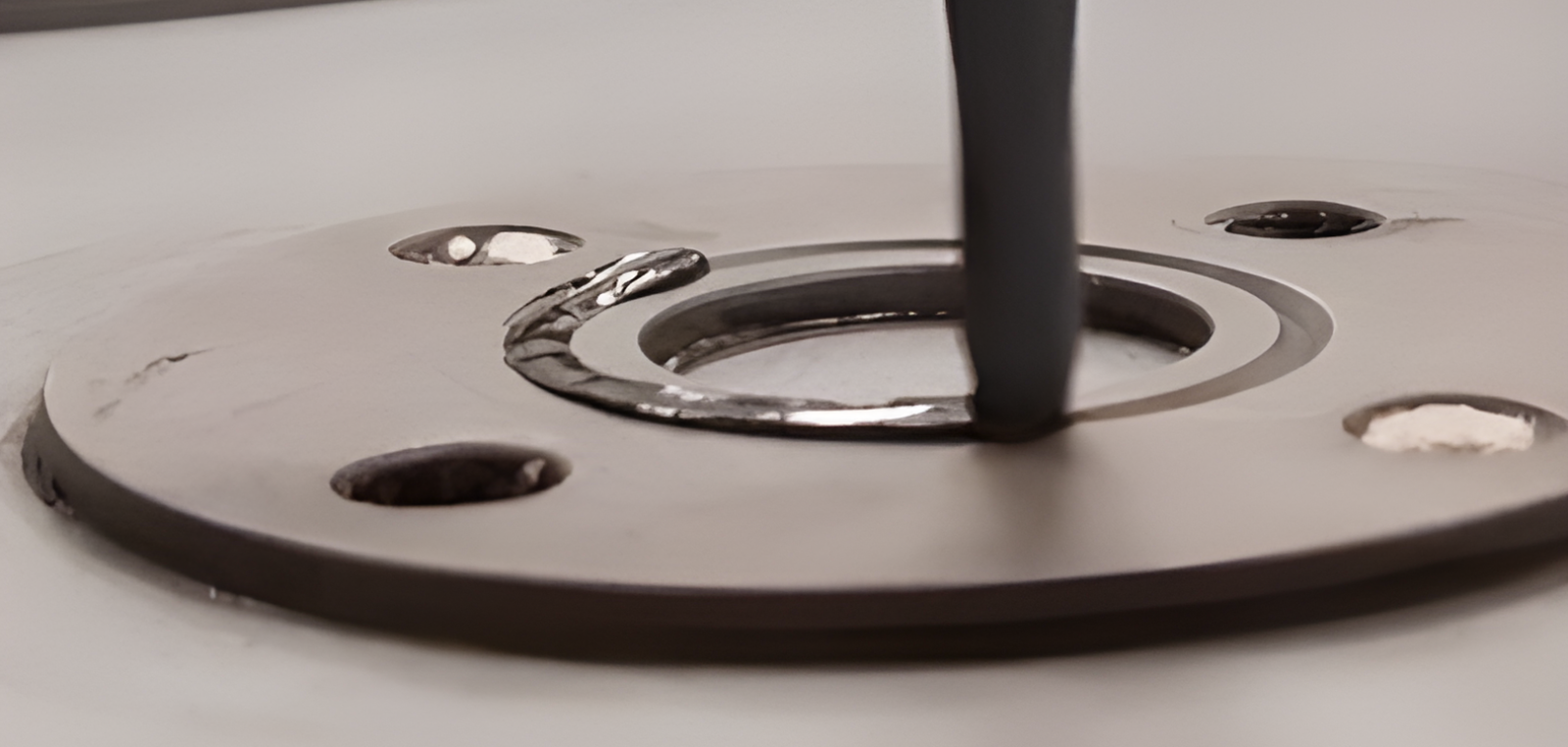 the application of sealant to painted metal bearings
