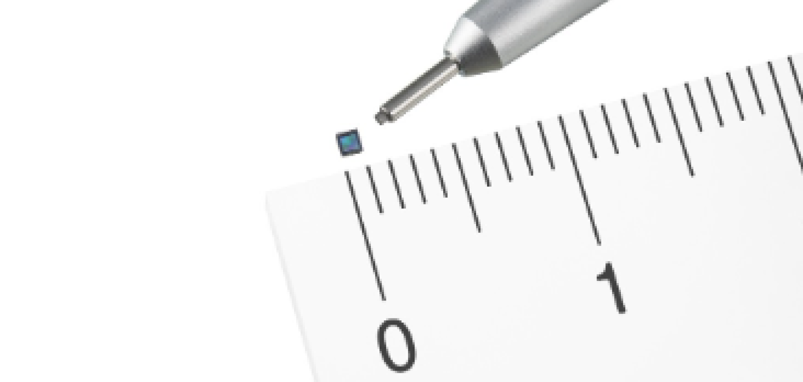 thin image sensor measures against a ruler and a pen