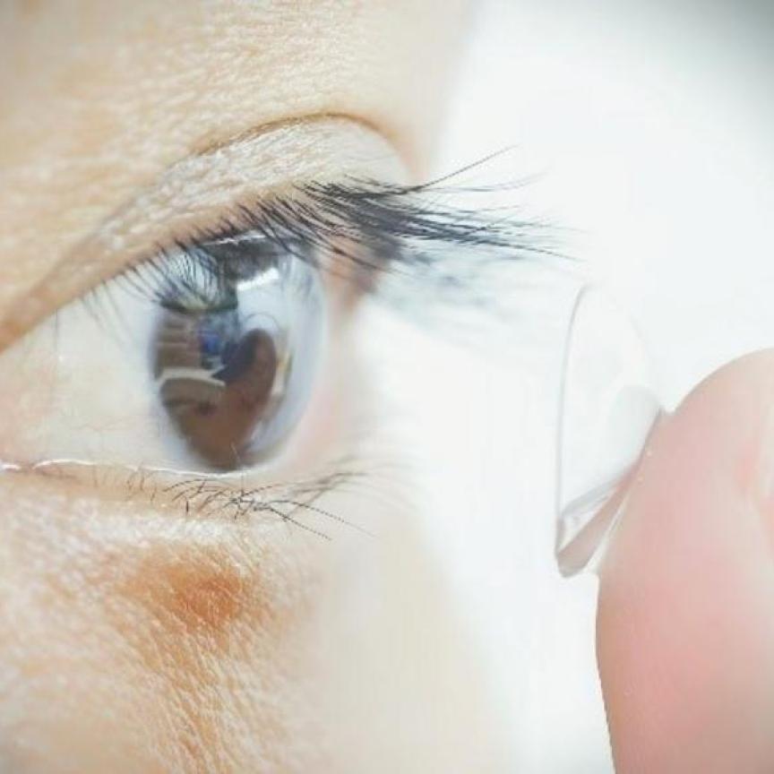 Study participant putting contacts in