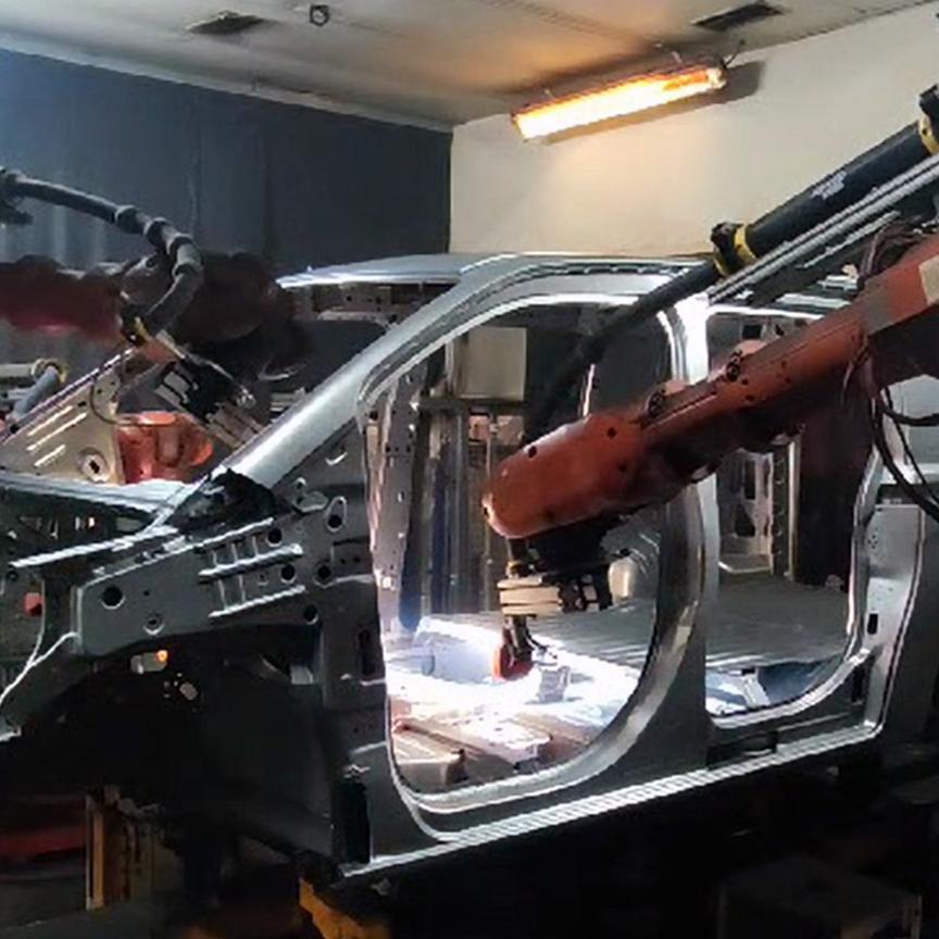 Machine vision inspects welds to car body
