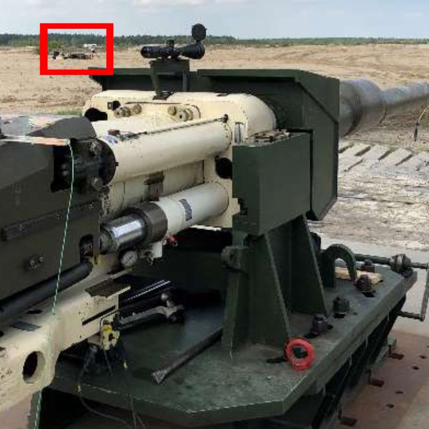 Smooth bore 120mm gun directed at a target with high-speed imaging tracker positioned in the red box out of the firing line