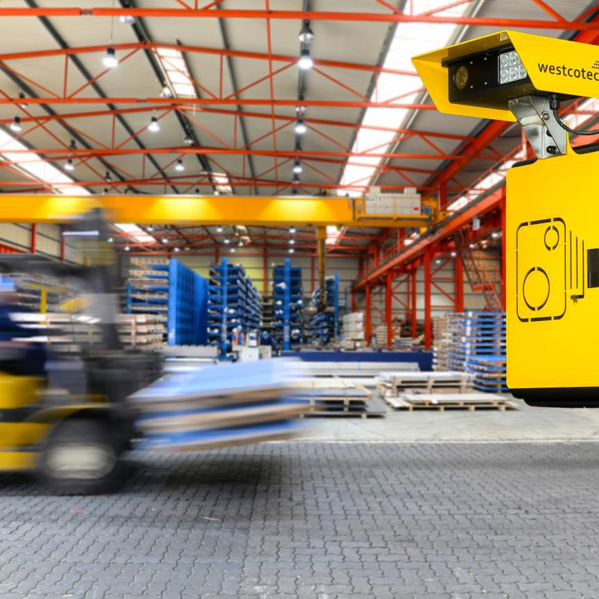 Forklift travelling quickly in logistics centre