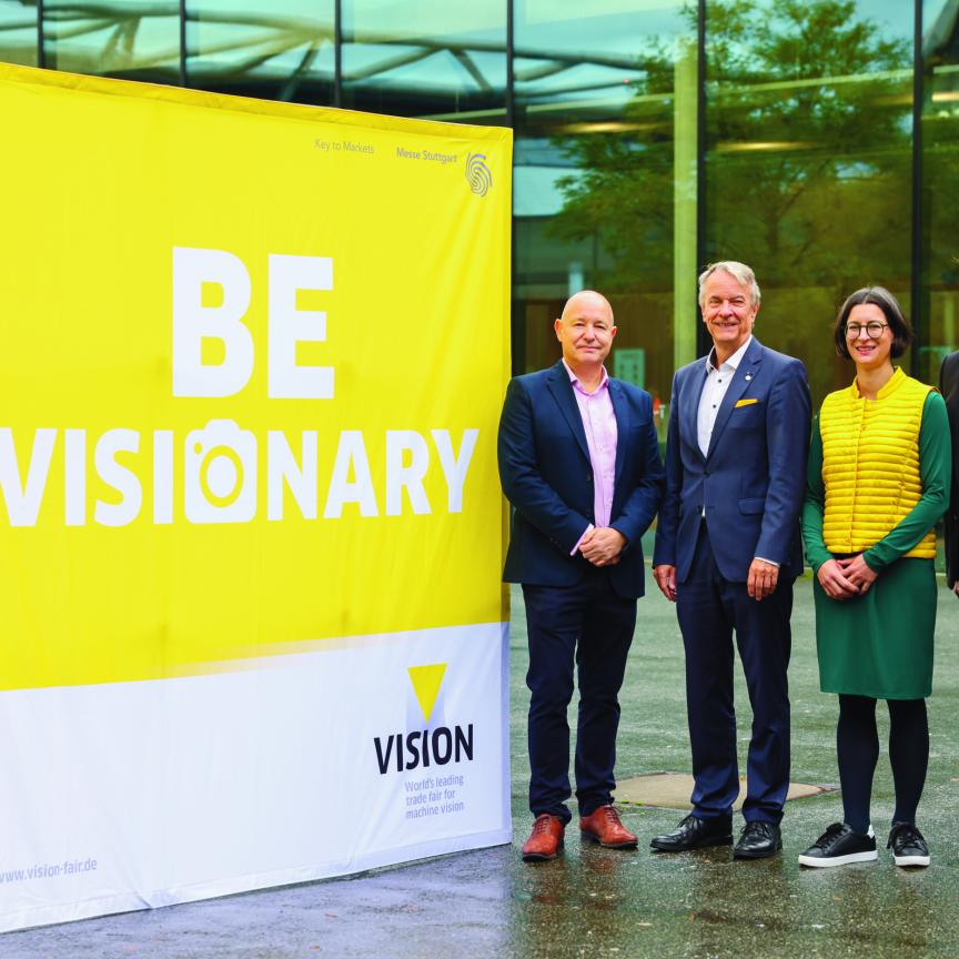Mark Williamson, Chairman of the VDMA Machine Vision Board, Roland Bleinroth, CEO of Messe Stuttgart, Anne Wendel, Director of the VDMA Machine Vision group and Florian Niethammer, Project Manager of VISION 2026 at Messe Stuttgart, in front of VISION 2024 trade fair at Messe Stuttgart